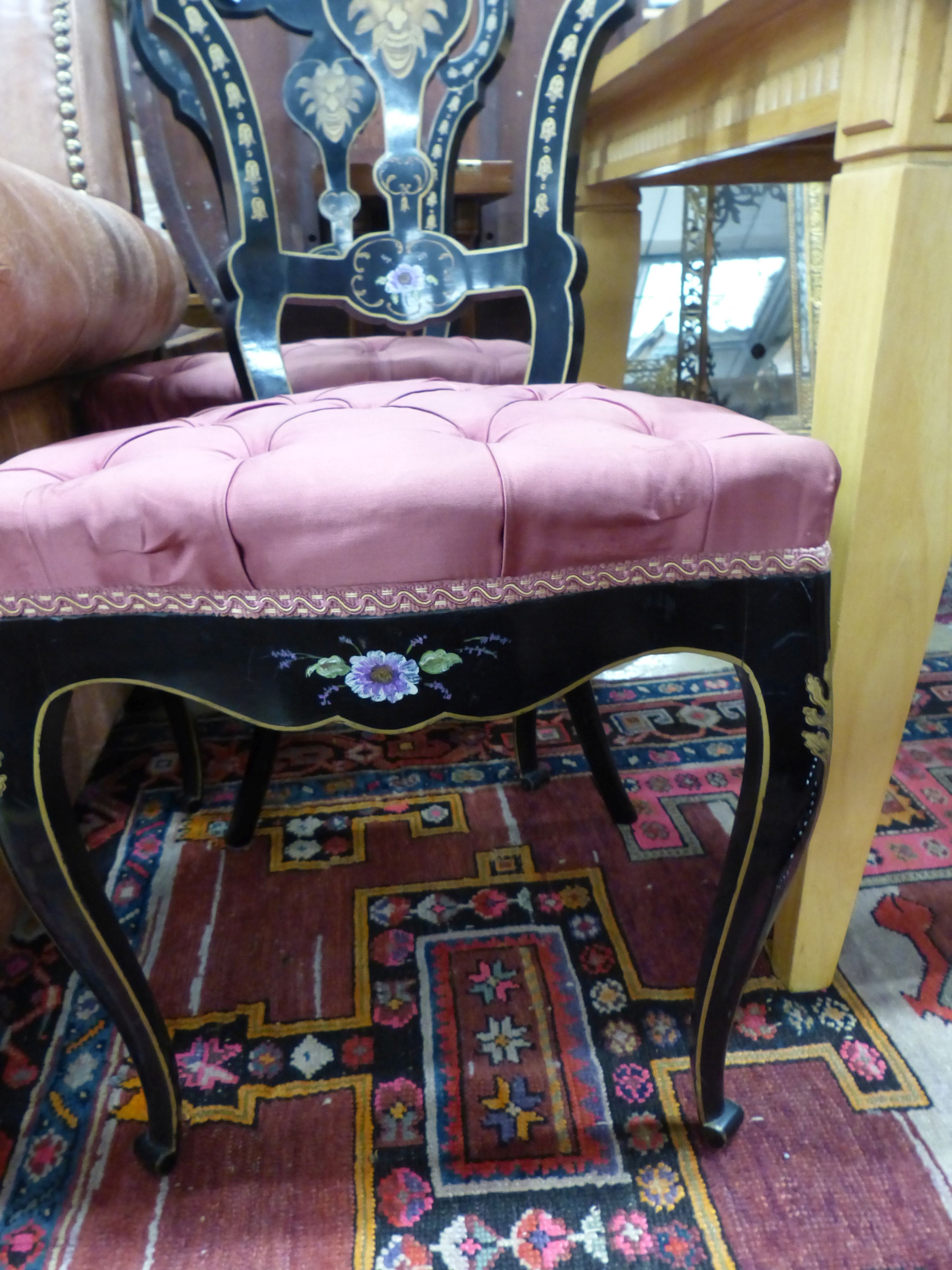 A pair of Victorian painted, ebonised side chairs.